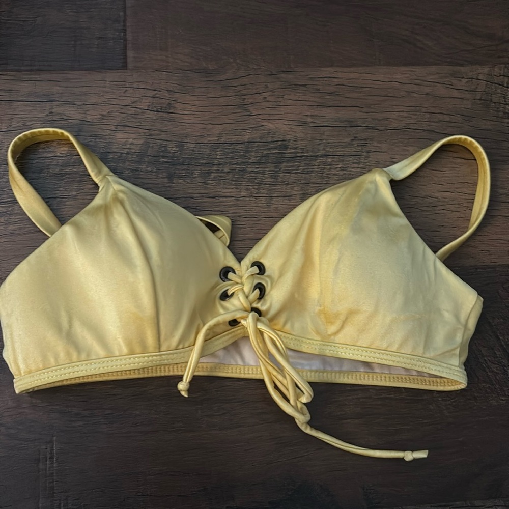 Yellow lace up bikini top.